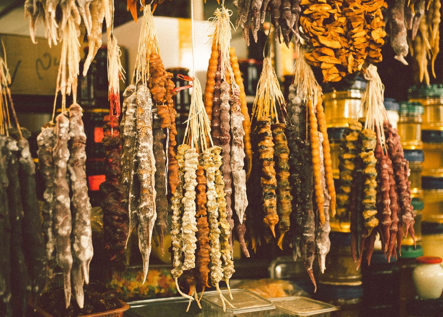 Churchkhela — strings of nuts dipped in grape must, hanging at a Georgian market