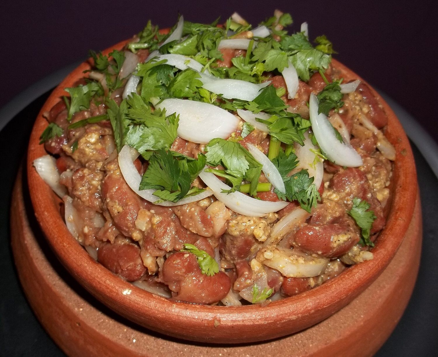 Lobio — Georgian red bean stew served in a clay pot with herbs