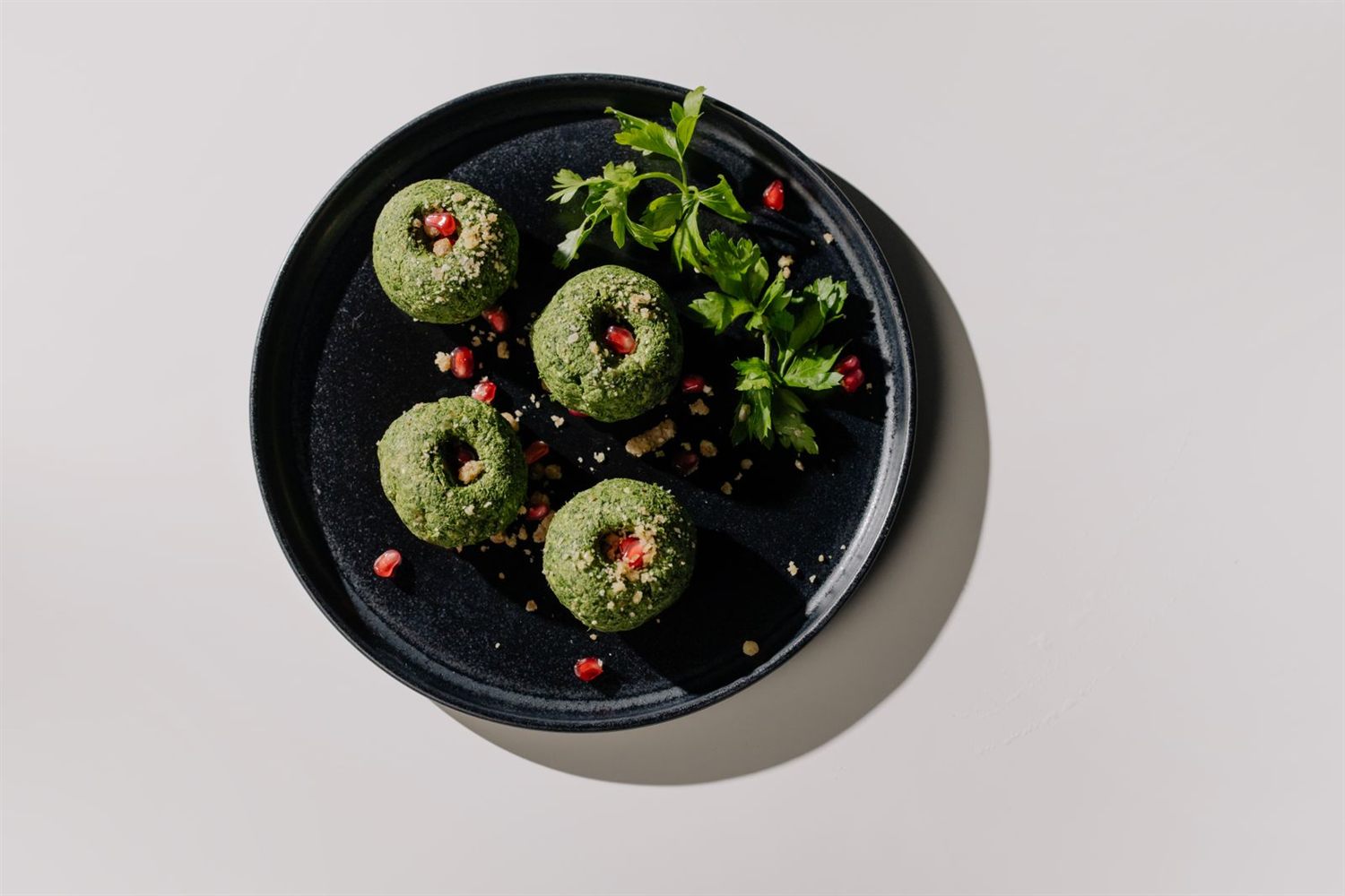 Pkhali — Georgian walnut and herb vegetable pâtés topped with pomegranate seeds